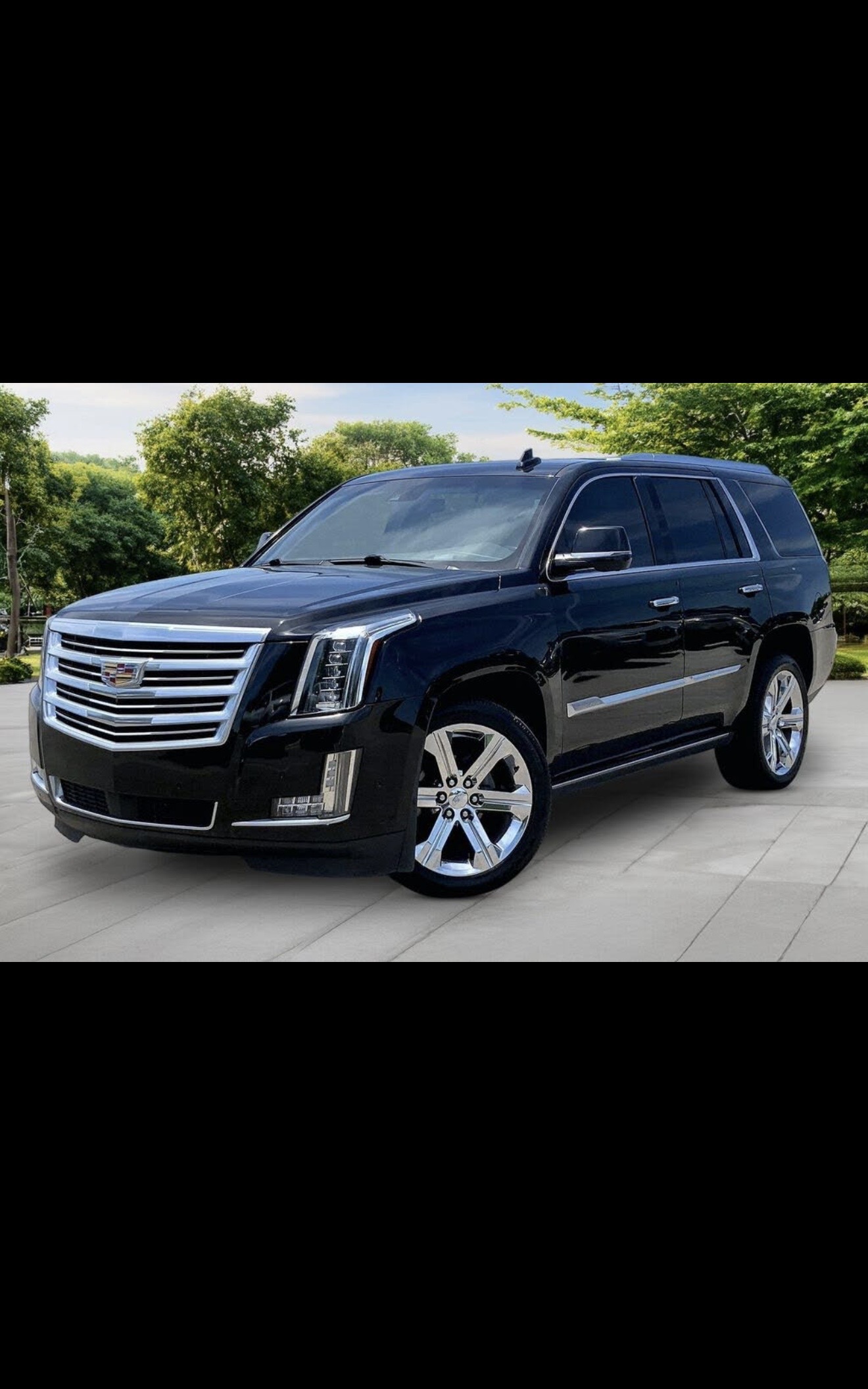 Black Cadillac Escalade side view