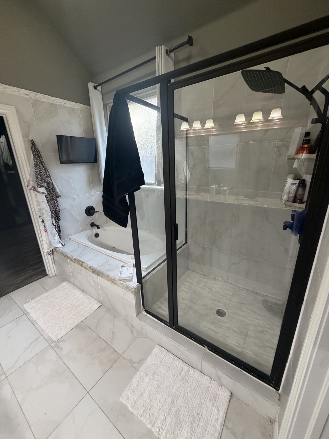 Primary bathroom with walk-in shower and jacuzzi tub