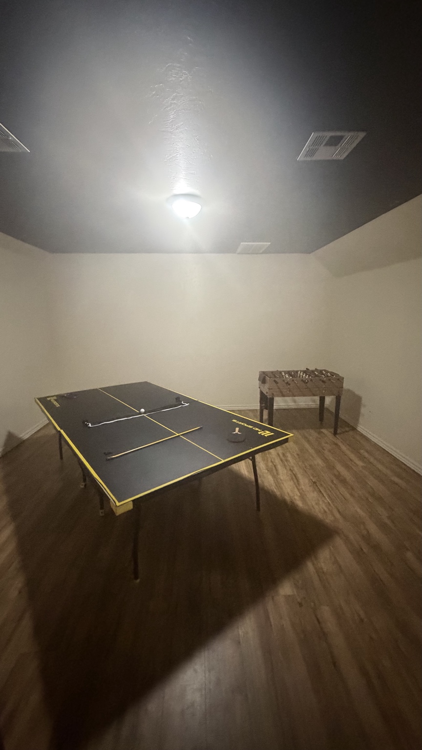 Upstairs game room with ping pong and foosball